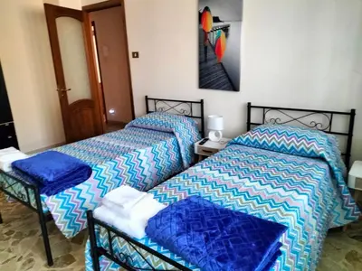 Letto o letti in una camera di New Dawn Apartment, Appartamento Turistico, casa per vacanza, tre camere indipendenti