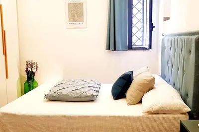 Letto o letti in una camera di L'Artista