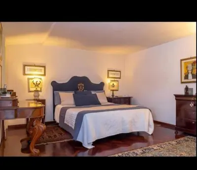 Letto o letti in una camera di Don Camillo Suites