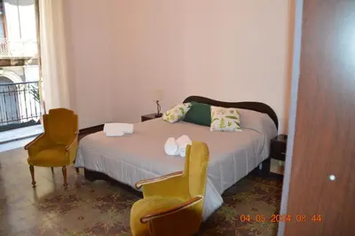 Letto o letti in una camera di GLI APPARTAMENTI DI PALAZZO UMBERTO I