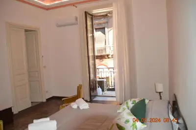 Letto o letti in una camera di GLI APPARTAMENTI DI PALAZZO UMBERTO I