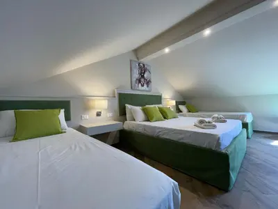 Letto o letti in una camera di MB Giurati Suites