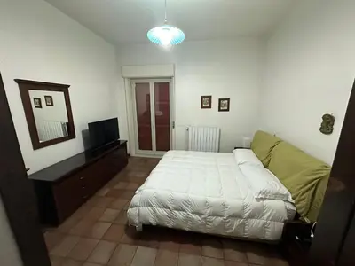 Letto o letti in una camera di Etna sotto il ciliegio