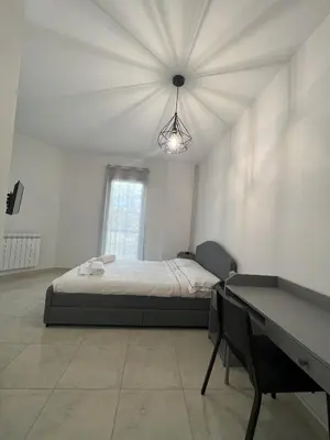 Letto o letti in una camera di Casa Vacanze Le Tre Scimmiette