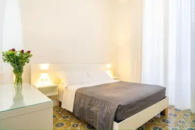 Letto o letti in una camera di B&B Giardino della Giganza