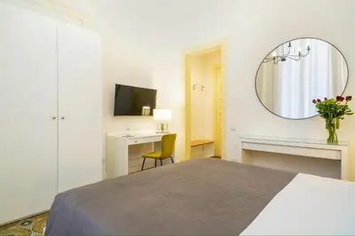Letto o letti in una camera di B&B Giardino della Giganza