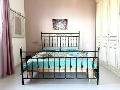 Letto o letti in una camera di Terrazza d'Amuri Santa Caterina