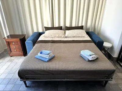 Letto o letti in una camera di Terrazza d'Amuri Santa Caterina