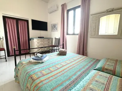 Letto o letti in una camera di Terrazza d'Amuri Santa Caterina